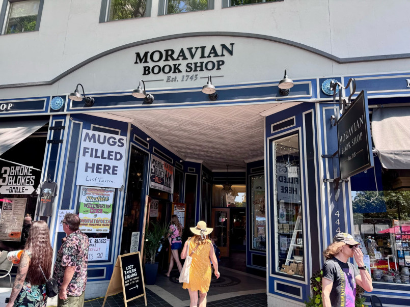 Interior of historic bookstore with wooden shelves filled with books