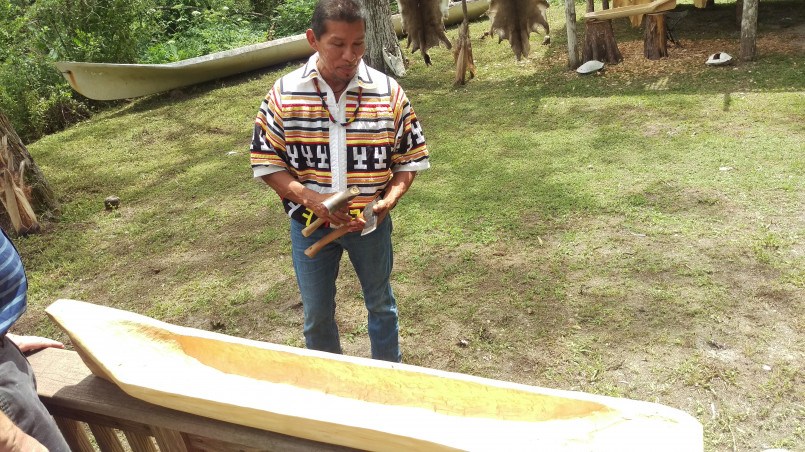 Navajo craftsman at Four Corners Navajo craftsman selling traditional artwork at the Four Corners Monument
