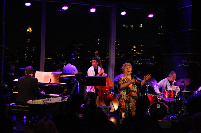 New York City jazz club performance Intimate jazz performance in a dimly lit New York City club with attentive audience