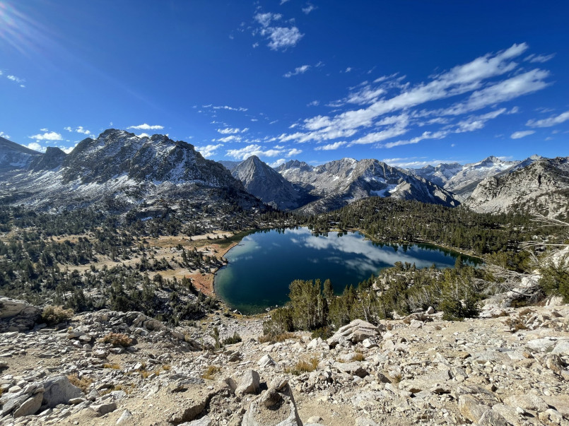 Pacific crest trail sierra nevada mountains Pacific Crest Trail winding through the high Sierra Nevada mountains with snow-capped peaks in the background