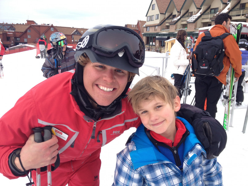 Family skiing together on a groomed beginner slope at Park City Mountain Resort