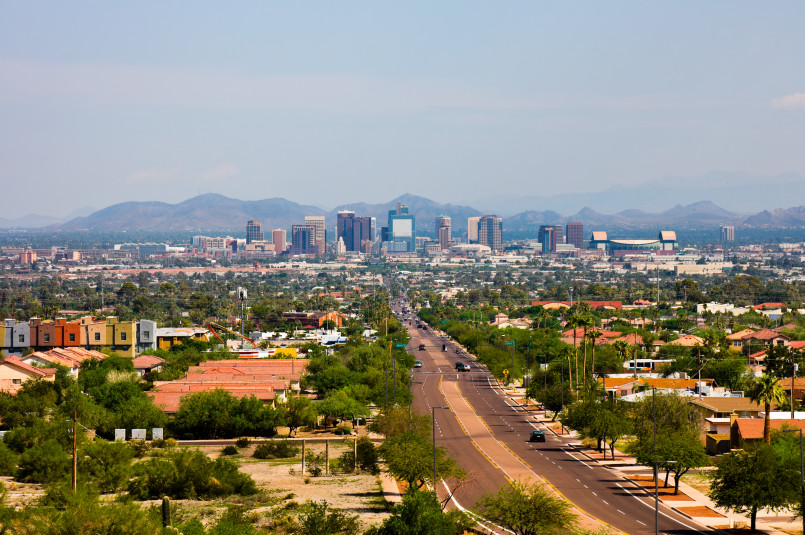 Heat waves rising from Phoenix streets with saguaro cactus in background
