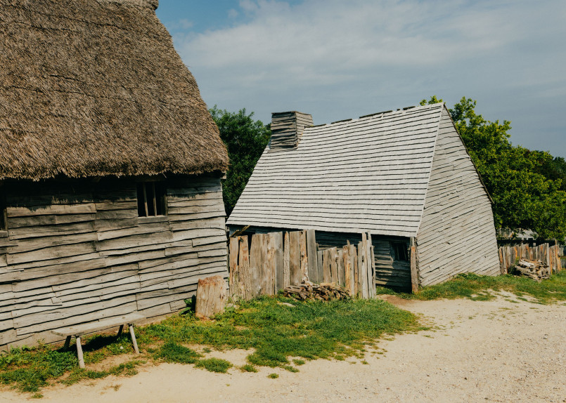 Plimoth Patuxet living history museum Costumed interpreters at Plimoth Patuxet demonstrating colonial life in recreated 17th century buildings