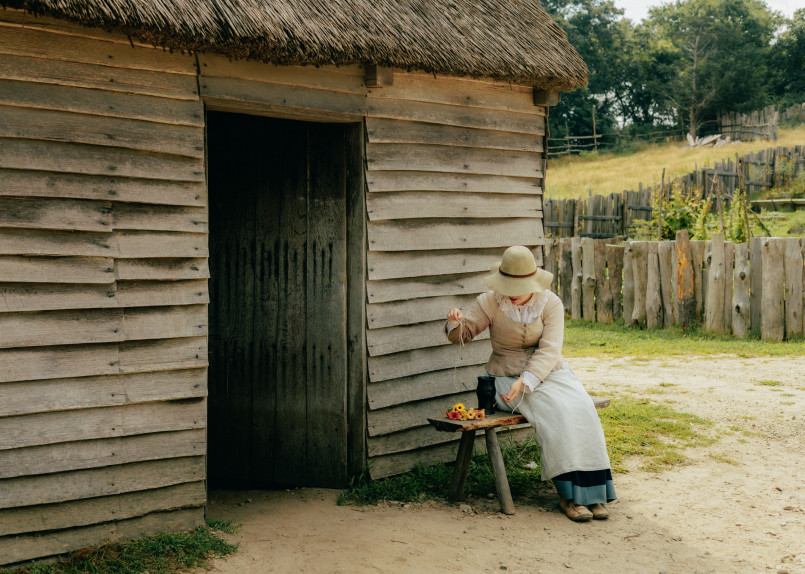 Plymouth Massachusetts Plimoth Patuxet Museums colonial village Living history museum at Plimoth Patuxet showing 17th century colonial buildings with costumed interpreters