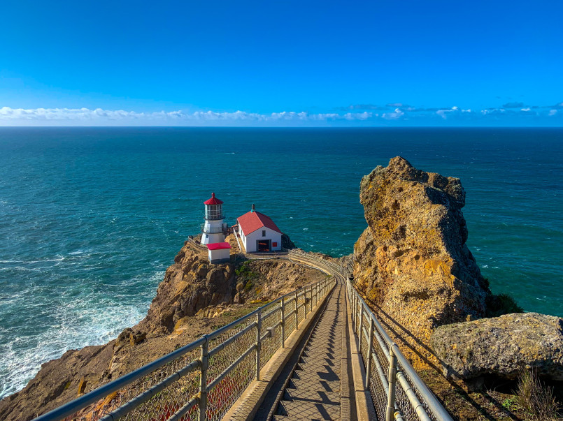 Point Reyes Lighthouse California headland stairs Small lighthouse below dramatic coastal headland accessed by steep stairway