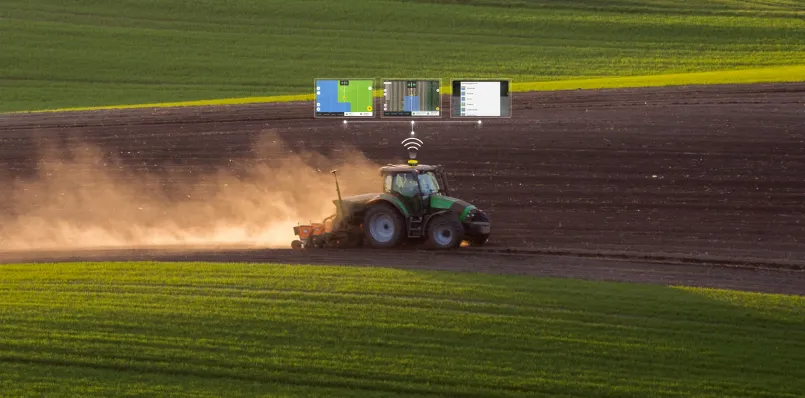 Modern tractor equipped with GPS guidance systems planting crops with precision technology
