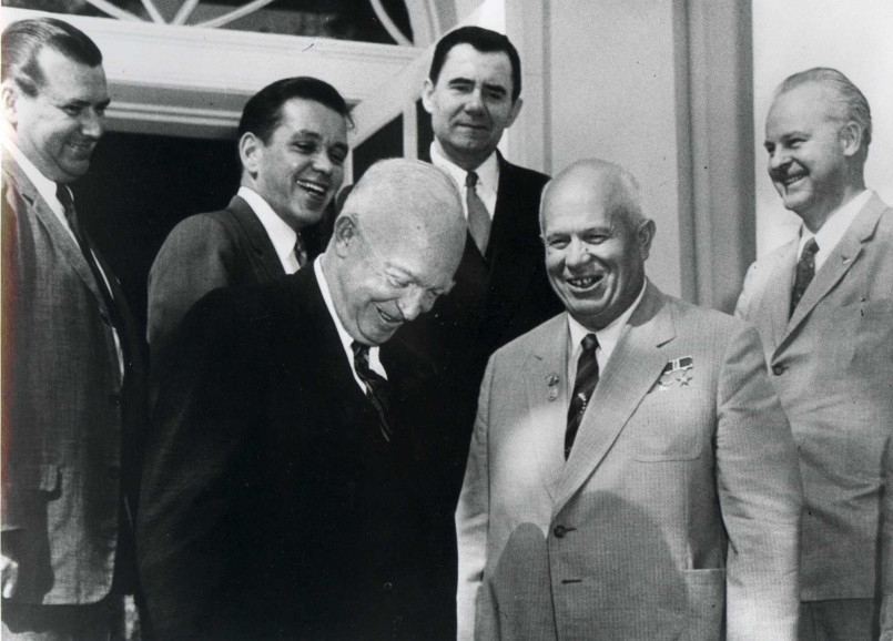 President Dwight Eisenhower at his desk signing official documents