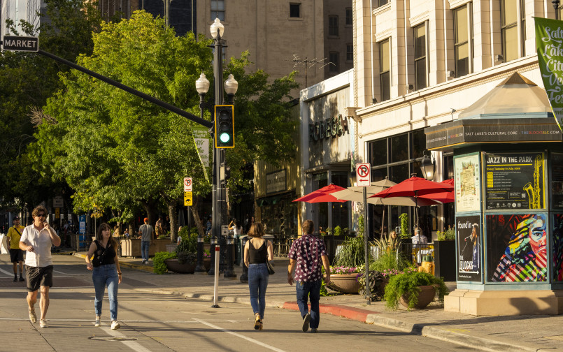 Retirement couple walking small town main street Senior couple strolling along quaint downtown street with shops and cafes