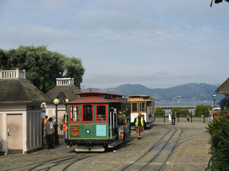 San francisco cable car street Historic cable car climbing a steep San Francisco street