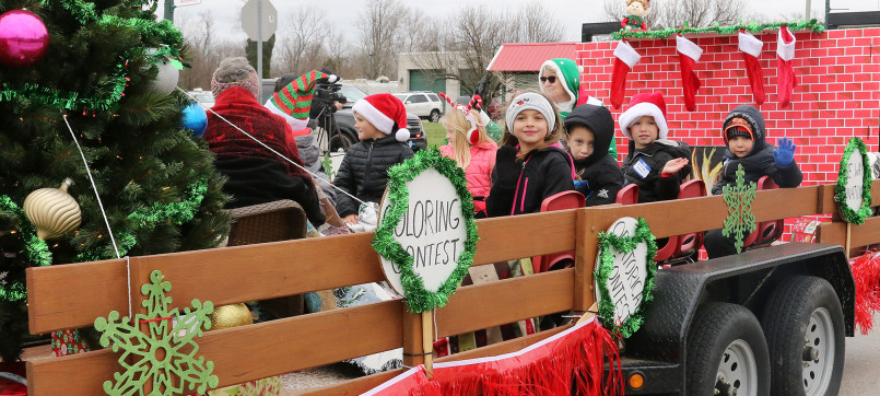 Santa Claus Indiana Christmas celebration Christmas parade in Santa Claus, Indiana with decorated floats and Santa waving to crowds