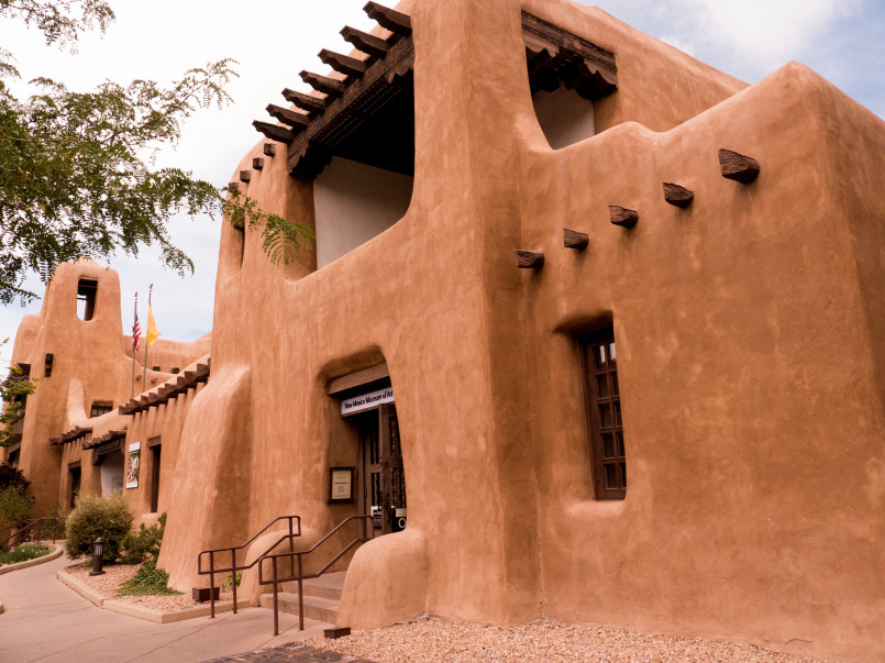 Santa fe new mexico adobe architecture plaza Traditional adobe architecture and blue sky in Santa Fe's historic plaza