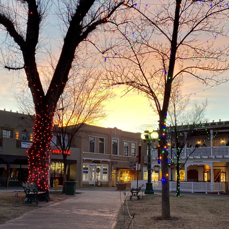 Santa Fe New Mexico historic plaza adobe architecture The historic Plaza in Santa Fe with adobe buildings, Native American vendors, and southwestern architectural style