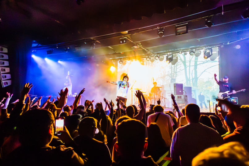 Seattle concert venue Packed Seattle music venue with enthusiastic crowd and stage lighting