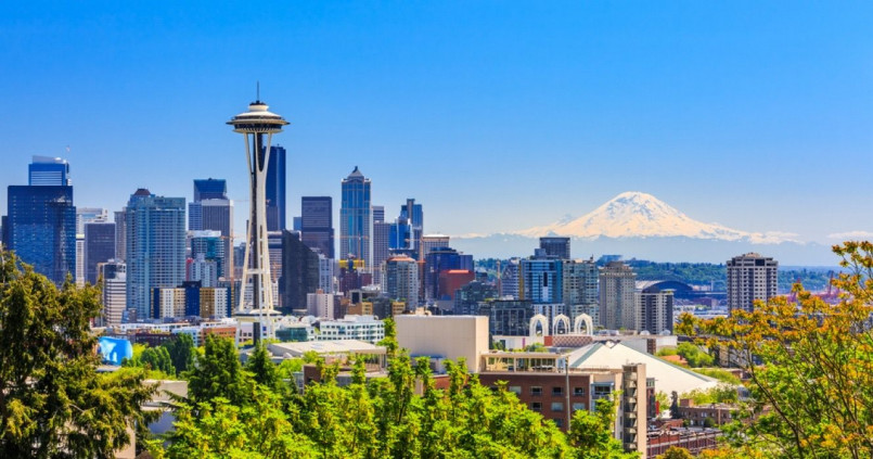 Seattle skyline featuring the Space Needle with Mount Rainier in the background