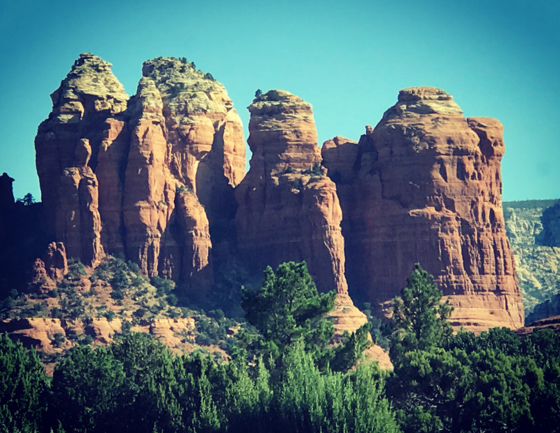 A spiritual vortex site with red rock formations and crystal arrangements in Sedona, Arizona