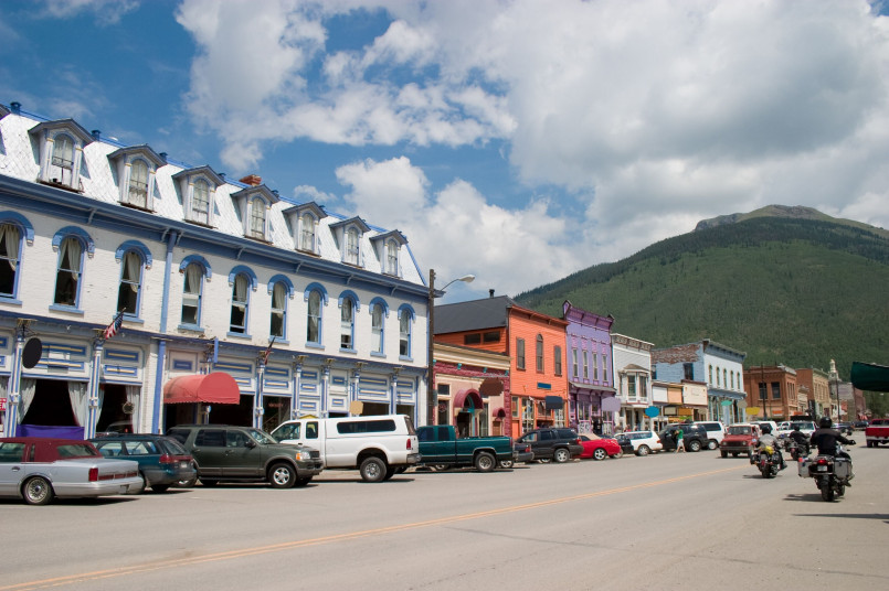 Historic main street in Silverton with Victorian-era buildings and mountain backdrop