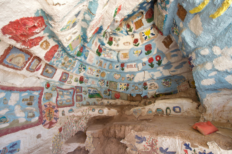 Colorful Salvation Mountain art installation with biblical messages in Slab City, California