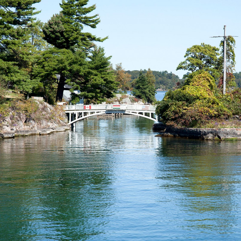 Small wooden footbridge connecting two islands in the Thousand Islands region
