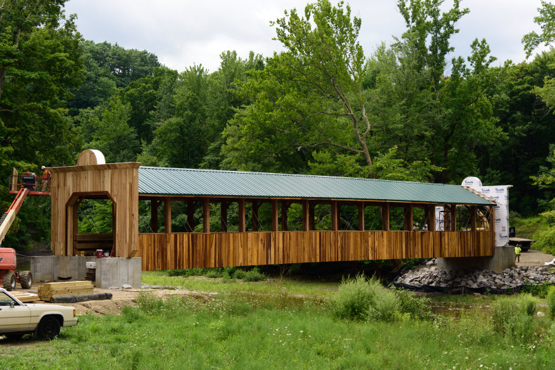 Long modern covered bridge spanning a deep river gorge in Ohio