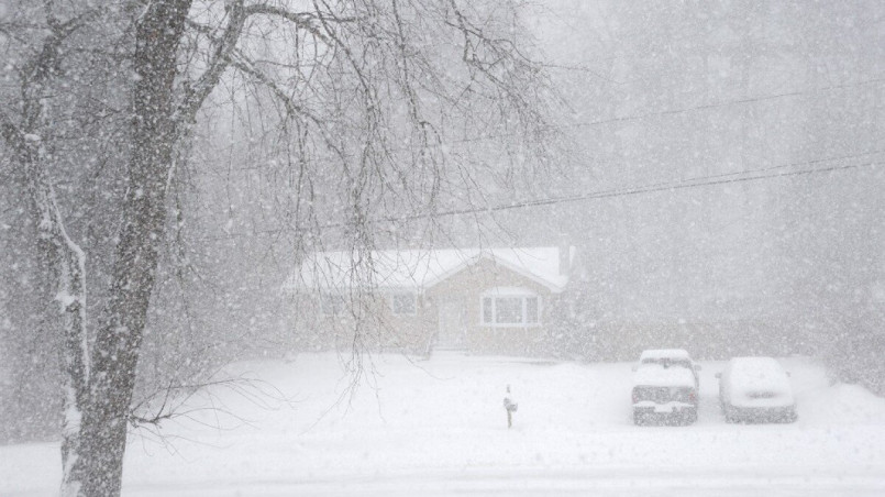 North dakota winter plains, blizzard House and cars covered in snow during a North Dakota blizzard