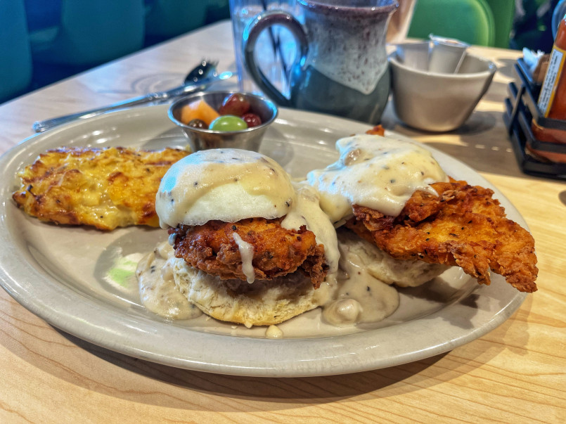 Crispy golden fried chicken pieces served with buttermilk biscuits and white gravy