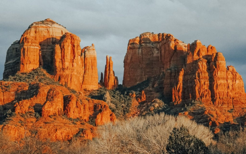 Stunning red rock formations of Sedona, Arizona with a small crystal shop in the foreground
