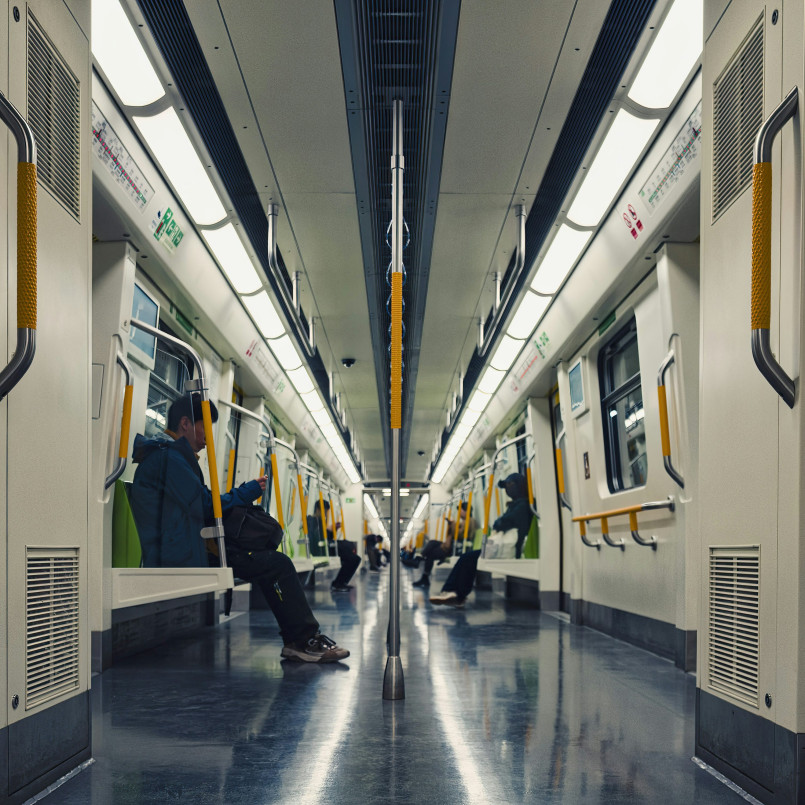 Subway train interior passengers commuting Passengers riding inside a modern subway train during rush hour