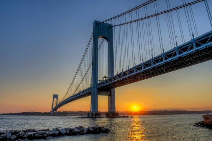 Verrazzano-Narrows Bridge New York sunset view Sunset view of the Verrazzano-Narrows Bridge connecting Brooklyn and Staten Island with New York City skyline in background