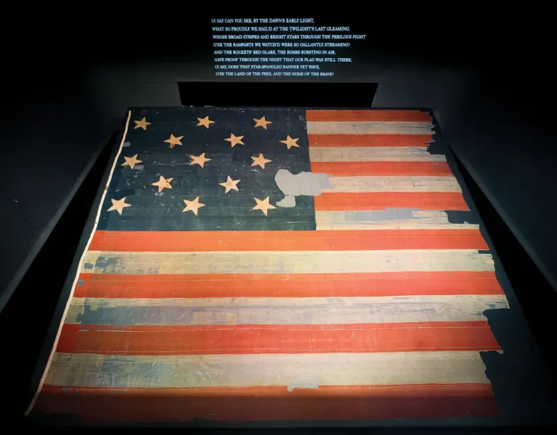 The preserved original Star-Spangled Banner flag on display at the Smithsonian National Museum of American History