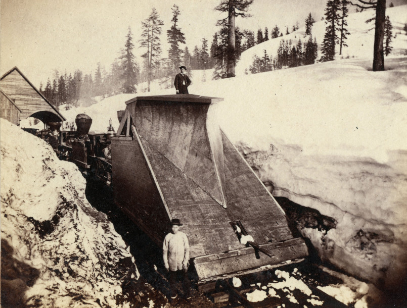 Workers constructing railroad tracks through the Sierra Nevada mountains
