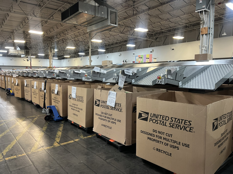 Usps processing and distribution center interior Large mail sorting facility with conveyor belts and packages