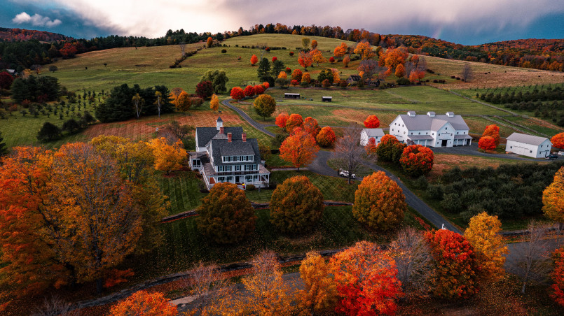 Vermont autumn small town Picturesque small town in Vermont with colorful autumn foliage and a white church steeple