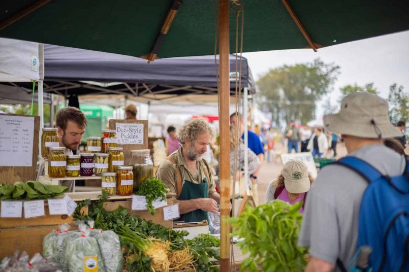 Vibrant Burlington Farmers Market with colorful local produce, artisanal cheese, and Vermont maple products