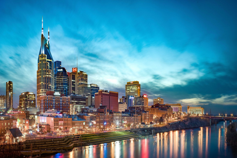 Vibrant downtown Nashville skyline with cranes showing ongoing construction