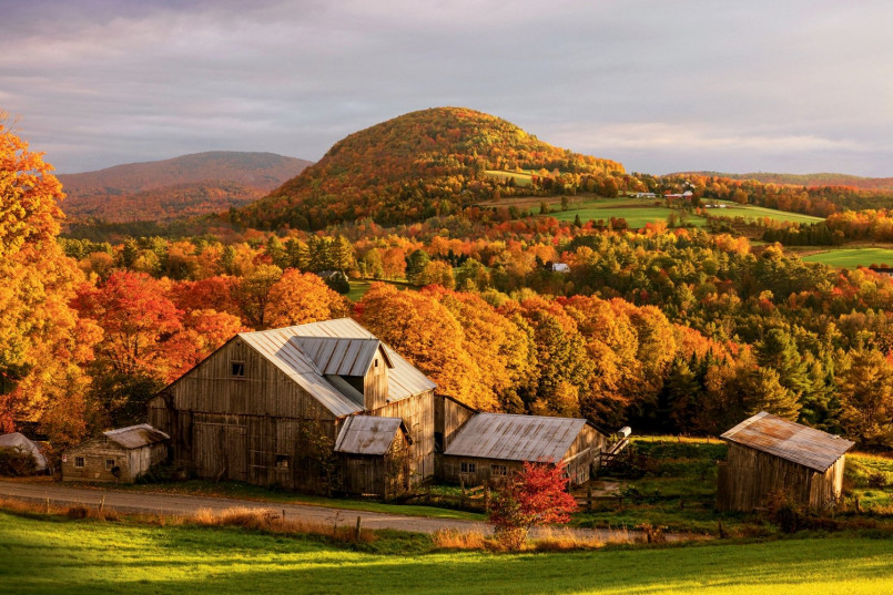 New England fall foliage Vermont Vibrant red and orange fall foliage in rural Vermont with white church