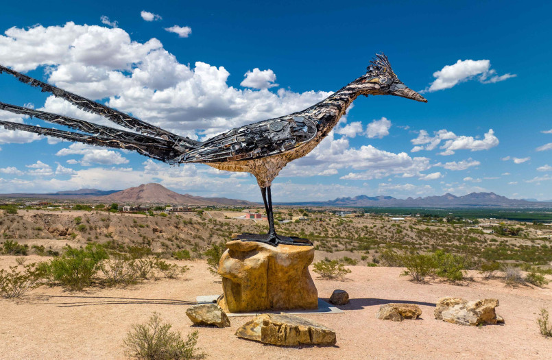 Classic roadside rest area with vintage cars parked