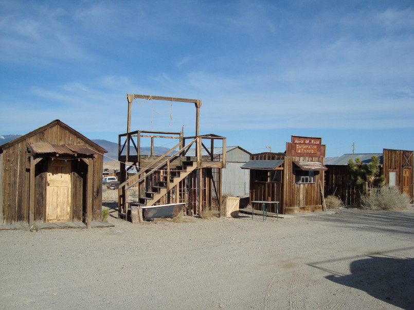 Gold point nevada ghost town Weathered wooden structures and mining equipment at Gold Point ghost town in Nevada desert