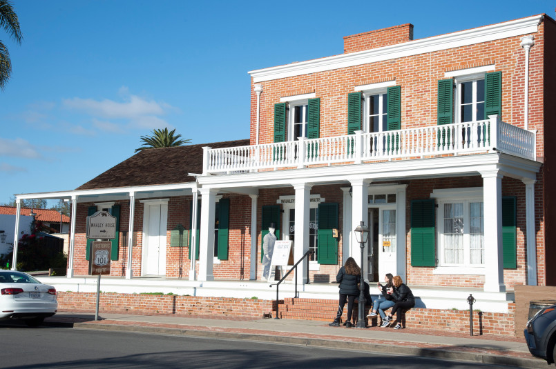 Whaley House San Diego Greek Revival style brick house with white columns and trim in Old Town San Diego
