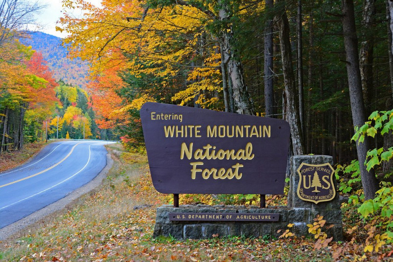 White Mountains of New Hampshire with vibrant fall foliage and covered bridge