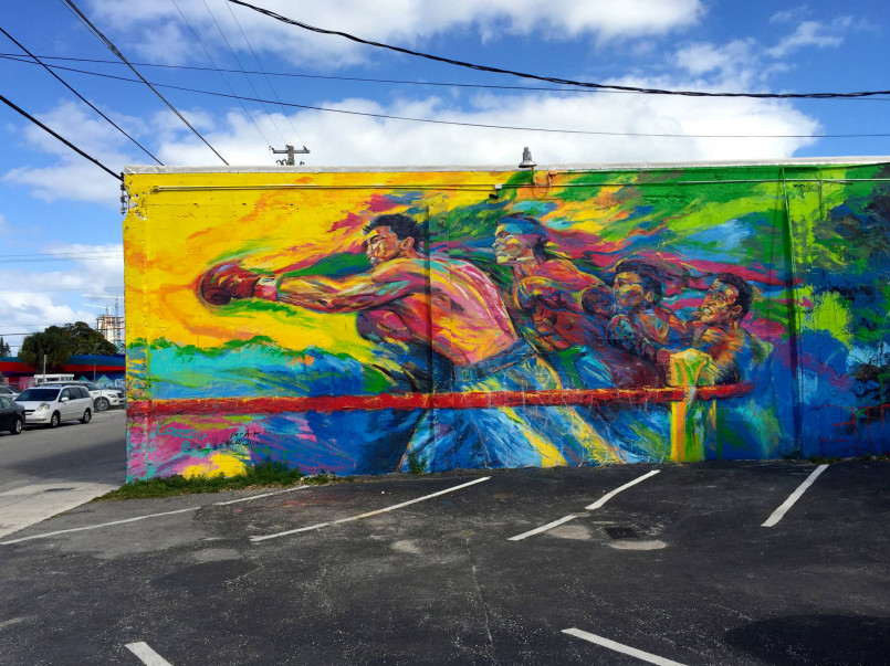 Wynwood walls miami colorful street art Tourists admiring colorful murals at Wynwood Walls in Miami