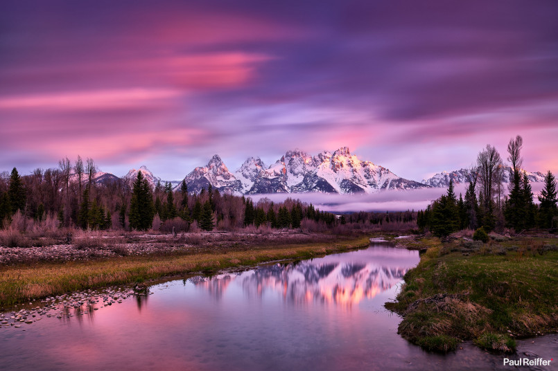 Grand Teton mountains reflected in the Snake River at sunrise