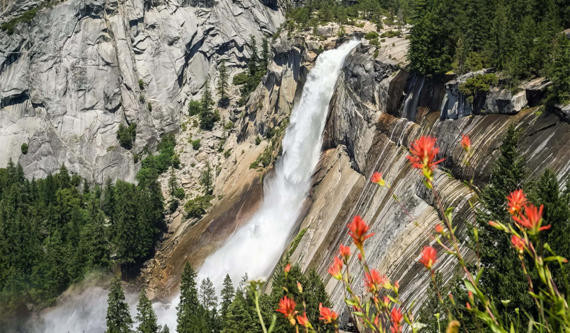 Yosemite Falls spring snowmelt Yosemite Falls at peak flow during spring with rainbow
