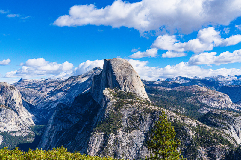 Yosemite Valley view with Half Dome Panoramic view of Yosemite Valley with Half Dome mountain and waterfalls visible